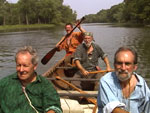 Voyageur brigades compete daily against each other in canoe races on the Des Plaines River.